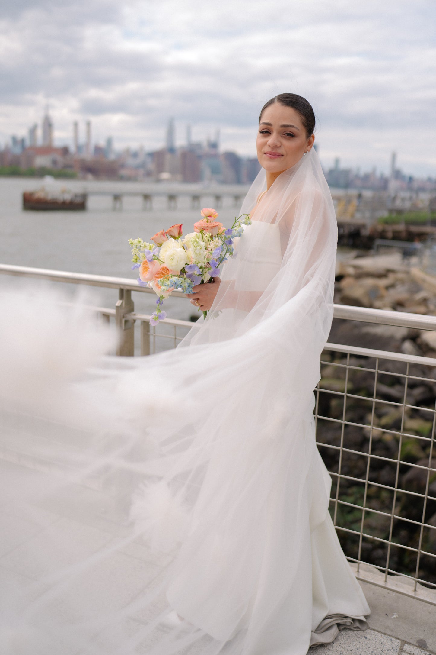 chic city wedding with long drop two layer flower cathedral veil under sleek clean bun