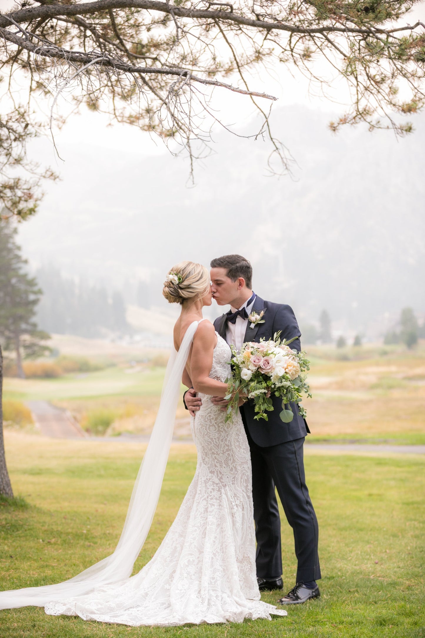 Northern California wedding with bride wearing white narrow tulle wing set