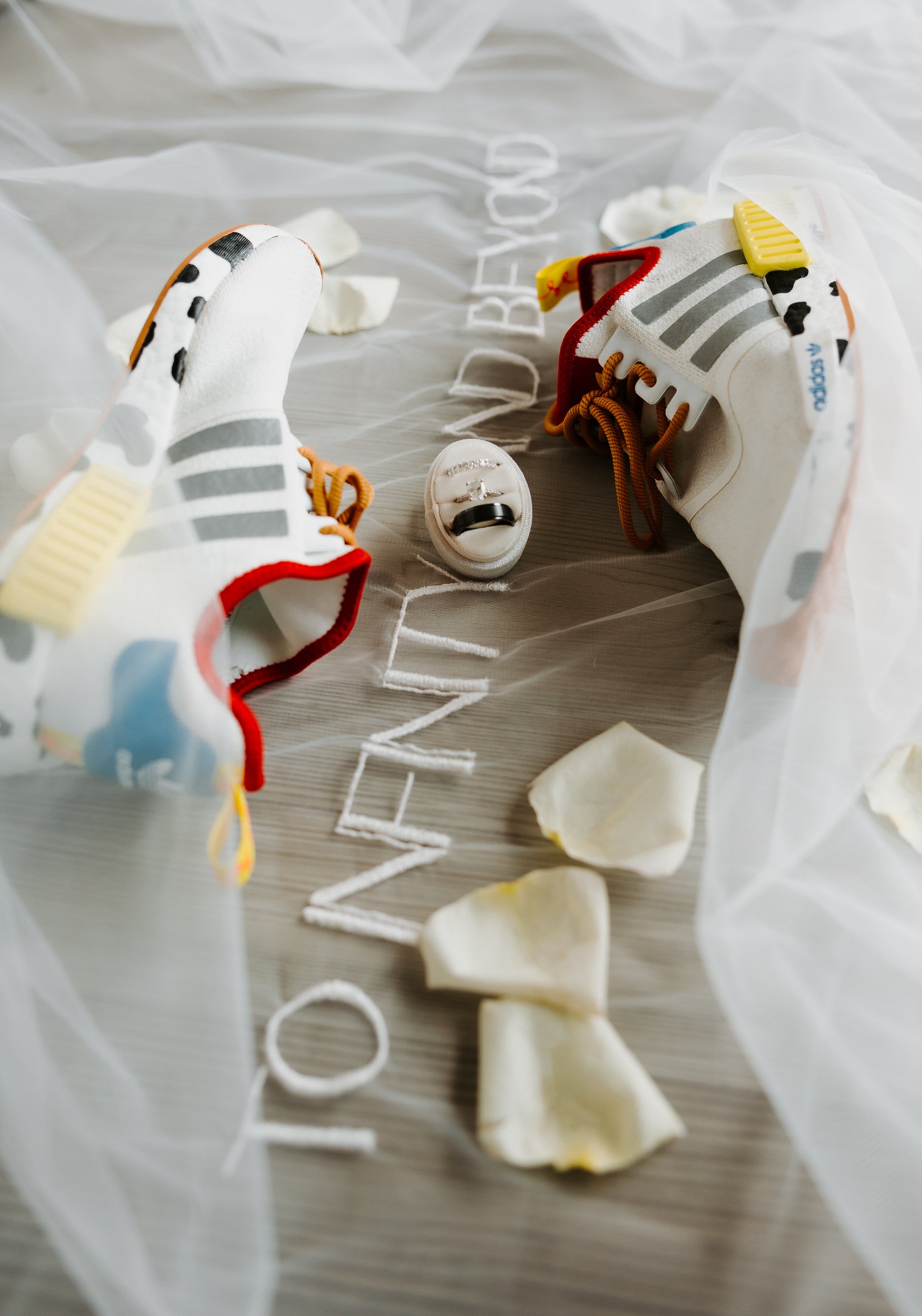 to infinity and beyond embroidered wedding veil for Disney inspired wedding with Adidas tennis shoes