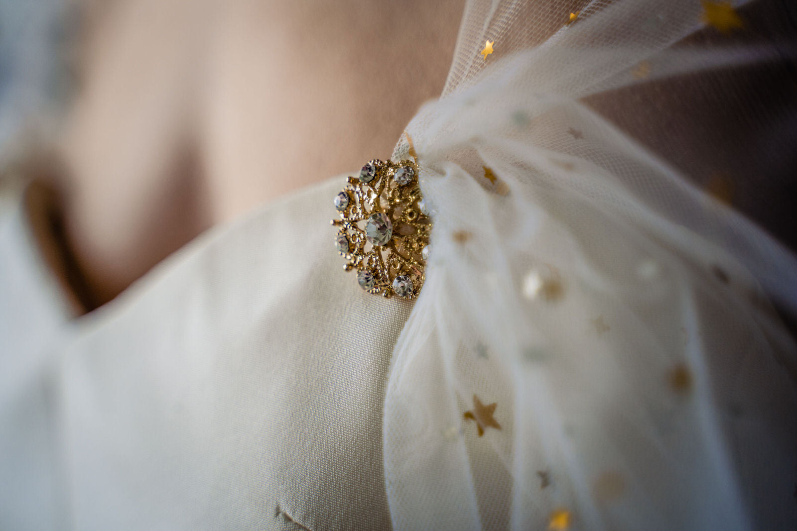 Load video: see real brides wearing a celestial bridal cape veil with sparkly stars in gold and silver