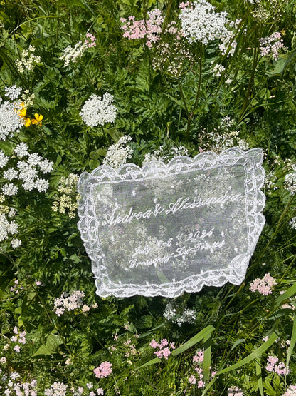 Lace custom handkerchief doily with floral patterns on a grassy background