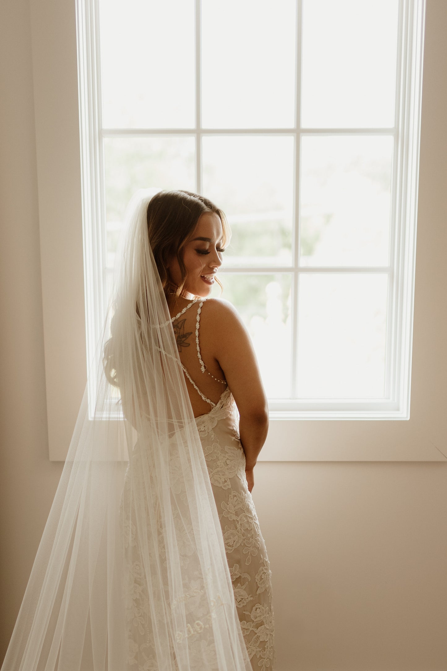 long ivory wedding veil with dainty embroidered couple's initials and wedding date