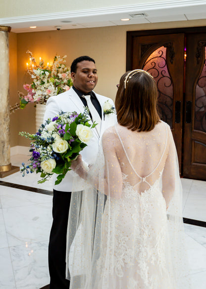 starry inspired wedding with bride in celestial bridal cloak and sheer low back lace gown