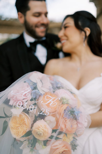 engaged couple initials embroidered on wedding veil with wedding date