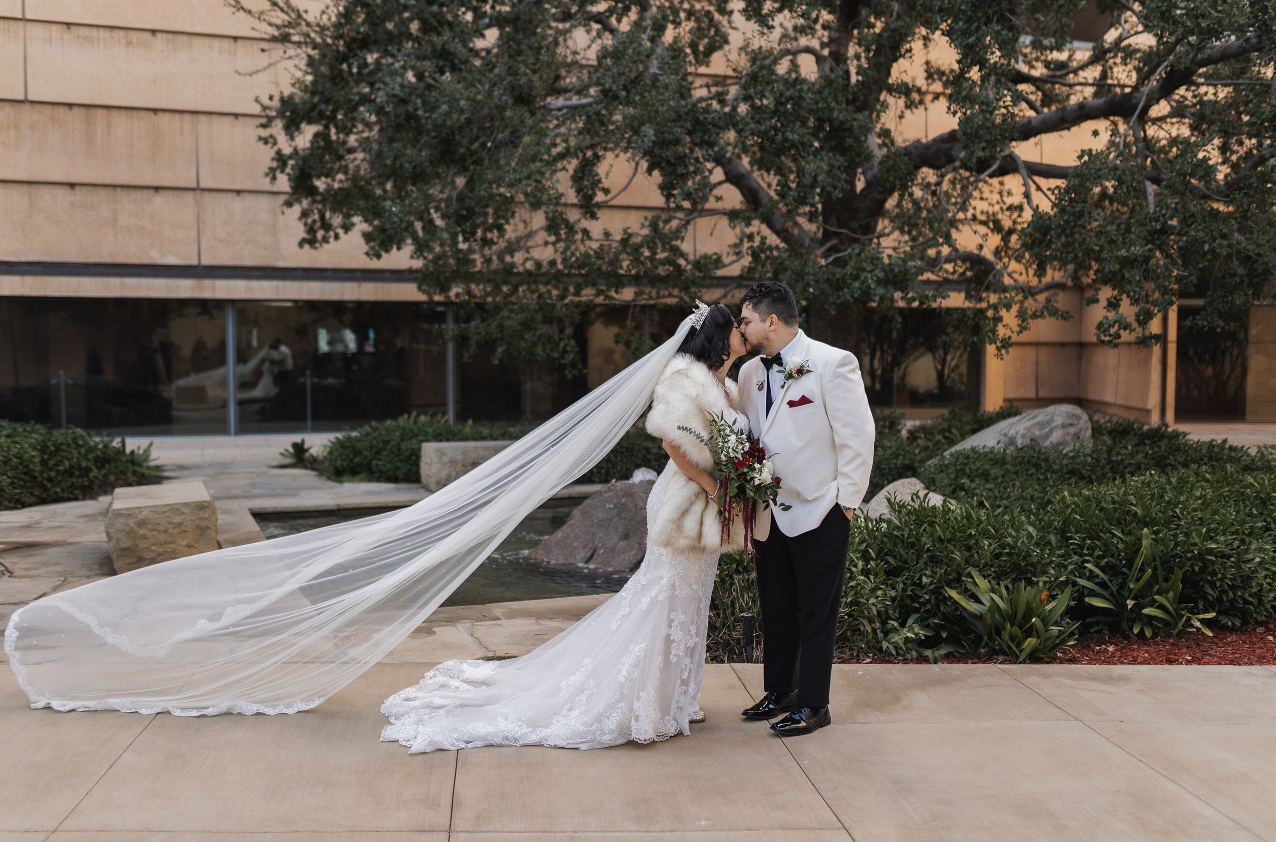 Load video: designer showing how to upgrade and epicycle vintage wedding dress into new bridal veil