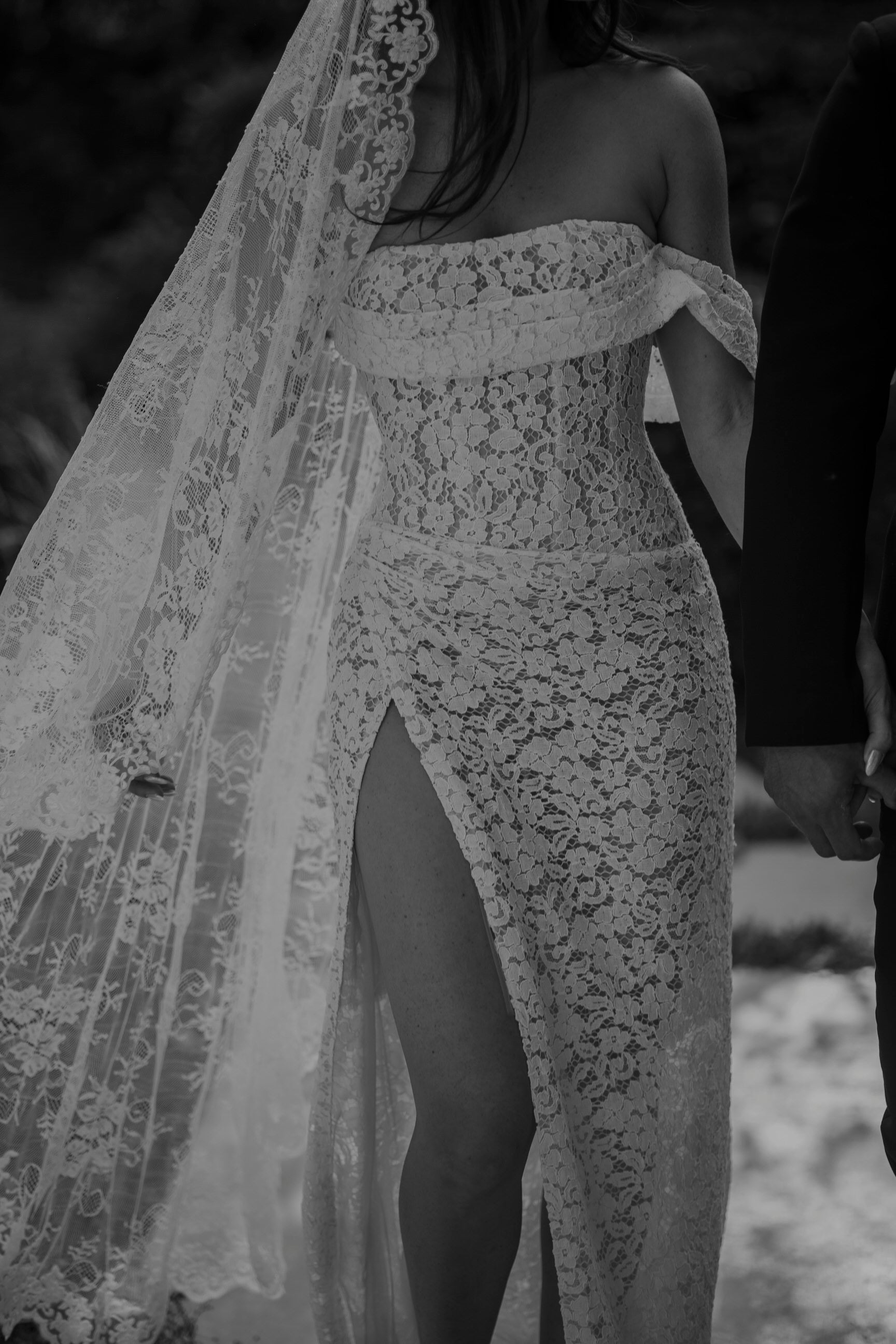 vine and floral lace trimmed mantilla bridal veil on bride in lace form fitted gown