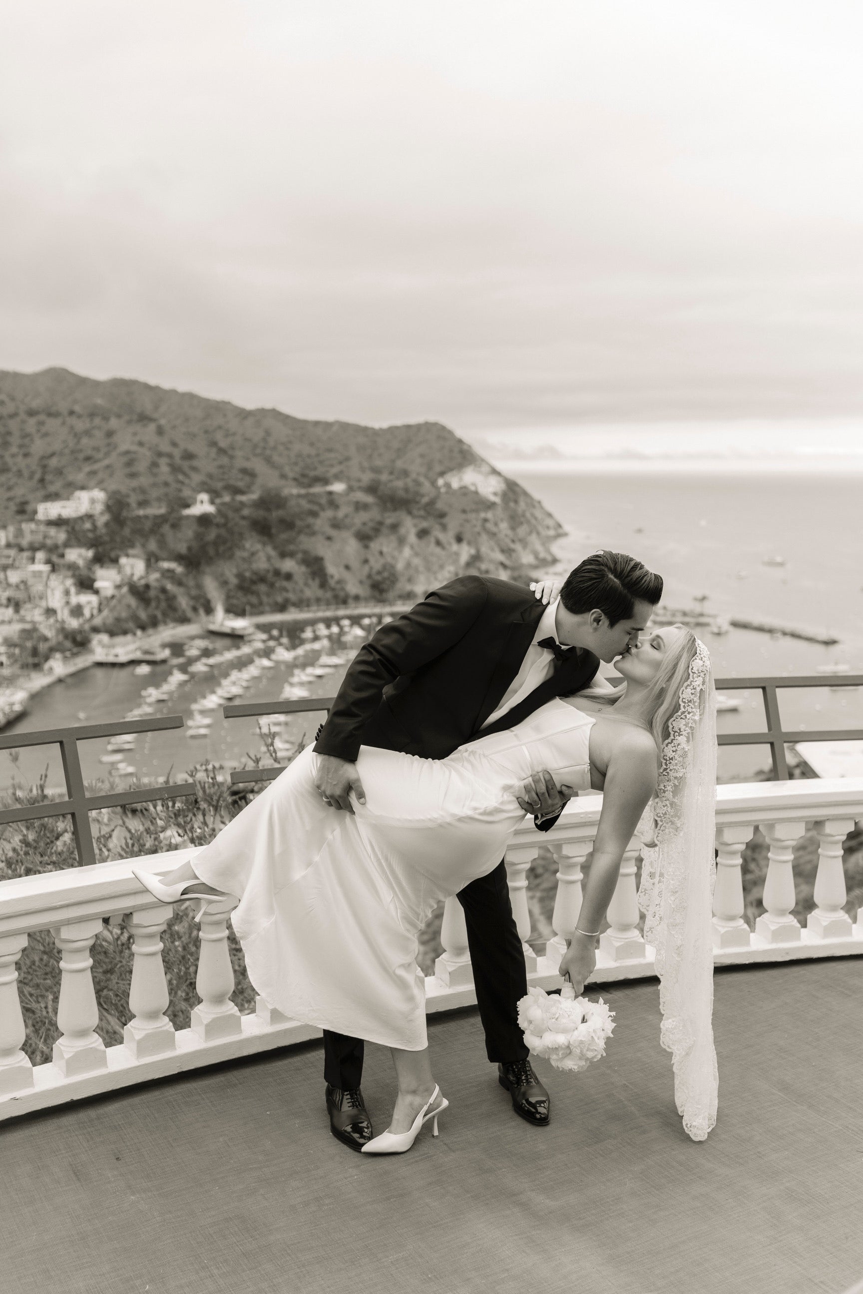 small destination wedding with bride wearing circle cut floral lace mantilla wedding veil