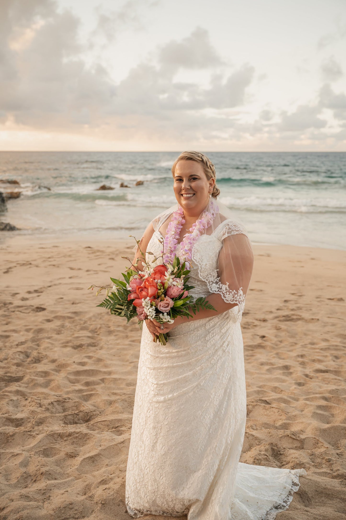maui beach wedding with lace veil and lei on bride