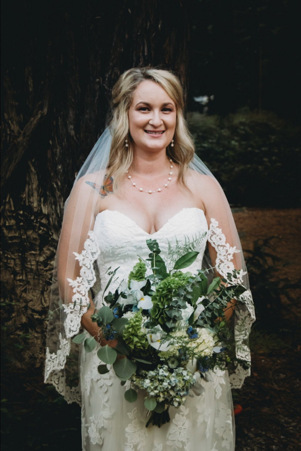 fingertip length lace bridal veil and strapless gown for casual whimsical forest wedding