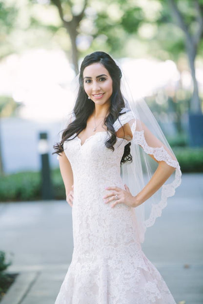 french alencon lace fingertip length wedding veil in half up hairdo